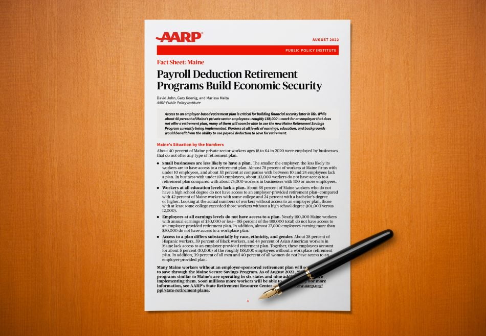 A printed copy of the AARP report on a desk